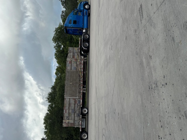 Large commercial semi-truck fully loaded with bee hives for nationwide pollination transport